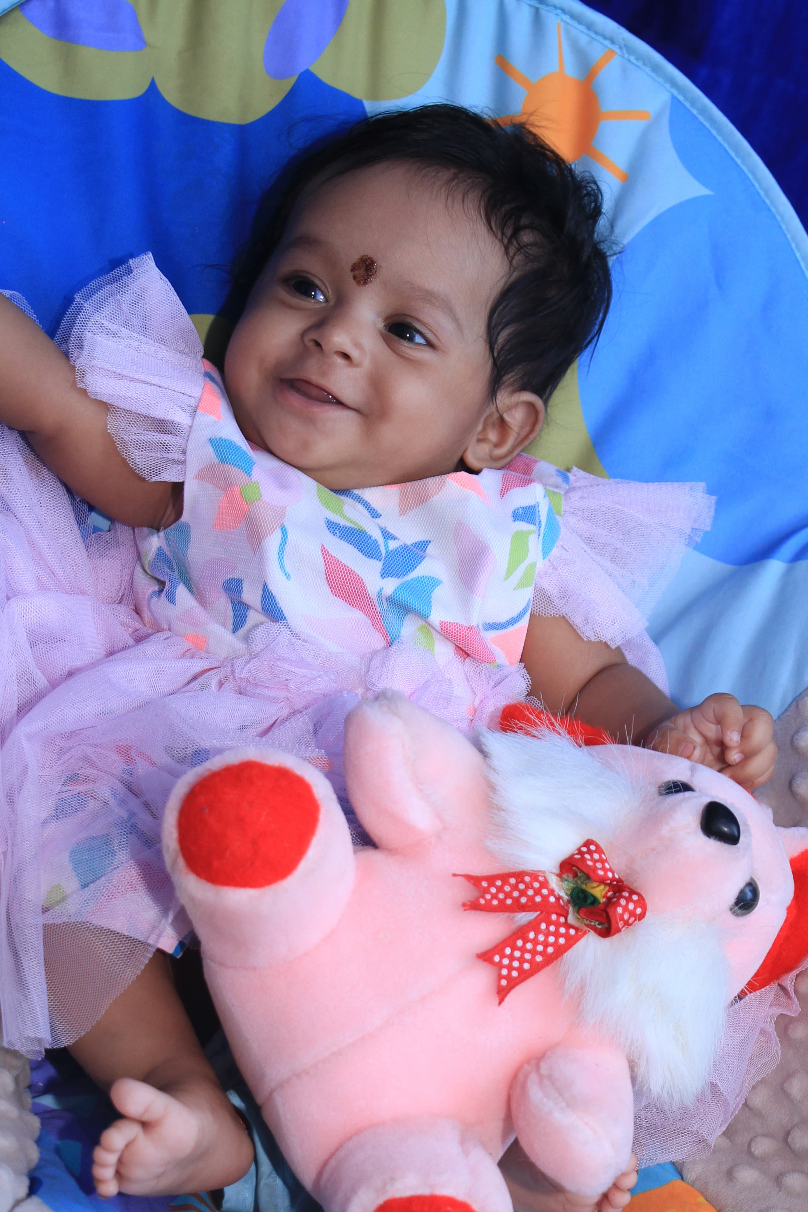 Baby holding hands with parents in a beautiful setting